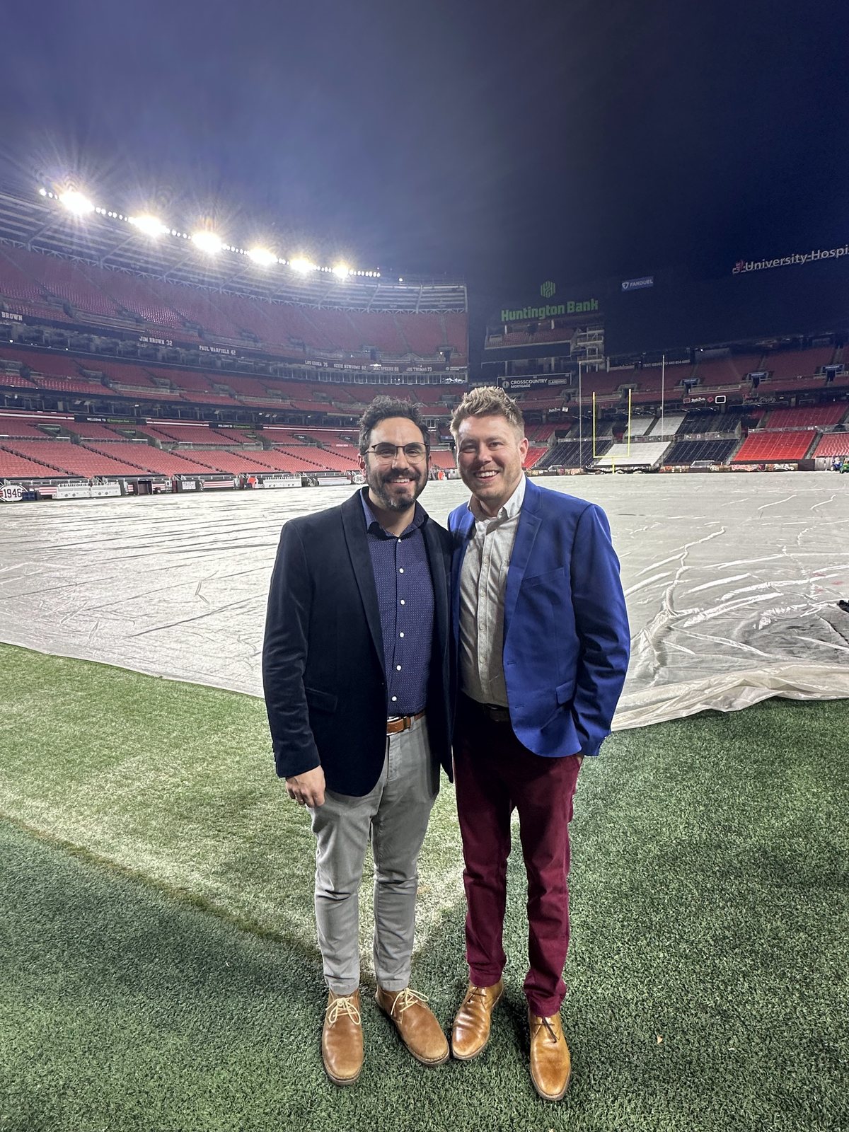Justin and Brandon on the field at the stadium